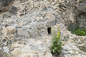 Window on the faÃÂ§ade of a stone wall