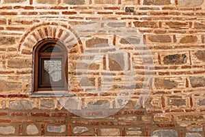 Window on the faÃÂ§ade of a stone wall