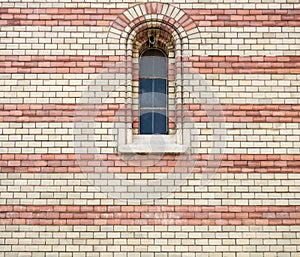 Window on the faÃÂ§ade of a stone wall