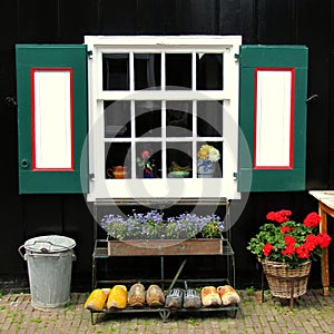 Window, flowers and clogs