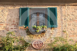 Window with flowers in the country Bolgheri, Tuscany