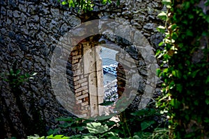 Window in the fortress overlooking the sea photo