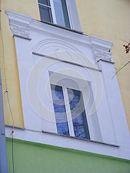 Window frame of classic architectural style building in Minsk, age of URSS, neoclassicism