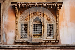 window frame with intricate carvings, bringing historial and cultural value to a space