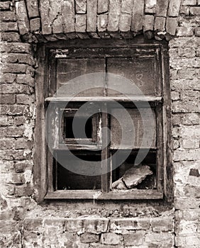 Window frame of ruined house. Destroyed building.