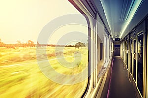 Window frame in train at sunset, travel concept.