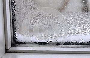 Window glass with condensation water on the inside