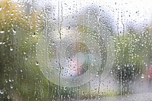 Window glass with water drops, closeup. Rainy weather