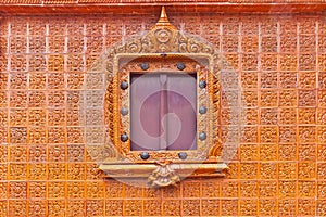 Window on glazed tile background