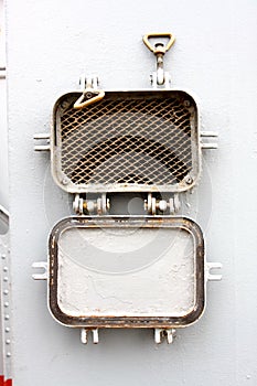 Window - the grate slatted porthole at a military