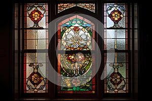 window with intricate design, including stained glass and leaded glass