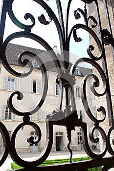 Window with iron window grate in famous hospice