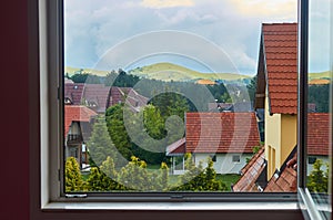 Window looking on houses and backyards