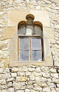 Window in medieval tower in an architectural ensemble of El Garraf, Barcelona