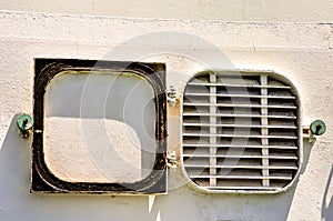 A window with a metal grate on the side