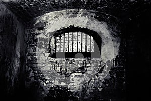 Window with a metal lattice in abandoned building photo