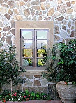 Window with mirrored glasses as a detail of the facade