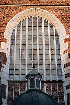 Window with mosaic and arch of Corpus Christi Basilica, Gothic church in Krakow, Poland