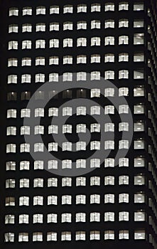 Window of the night empty multi-storey skycraper building photo