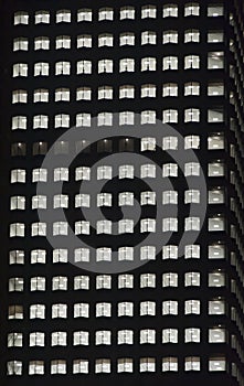 Window of the night empty multi-storey skycraper photo