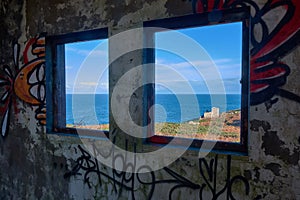 Window of and old and abandoned military base photo