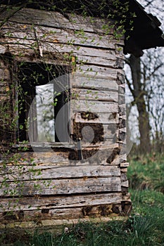 Window of old destroyed house in village. Countryside background. Landscape photoshot