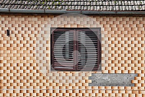 Window on a old house covered in tiles