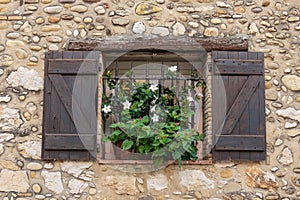 Window in an old house decorated and flowers