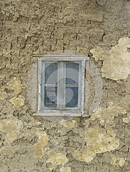 Window on old mud house in Vojvodina Serbia