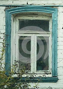 A window in an old residental brick house.