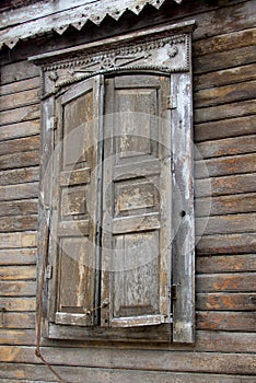 Window of an old russian house decorated with wood carving