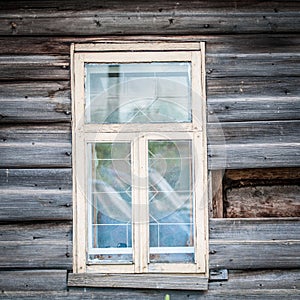 Window of old traditional russian wooden house.