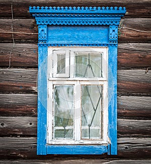 Window of old traditional russian wooden house.