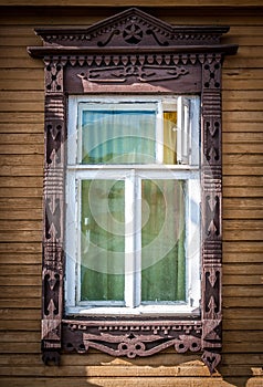 Window of old traditional russian wooden house.