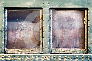 Window on old train passenger car.