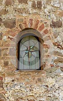 Window in the old wall of church