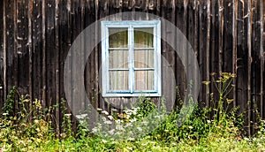 Window in the old wooden house in the Carpathians