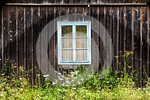 Window in the old wooden house in the Carpathians