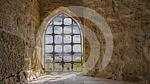 The window opening in the ancient Citadel of Qaitbay is barred.