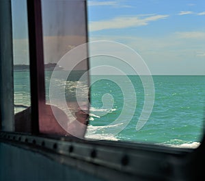 Window opening to caribbean vacation