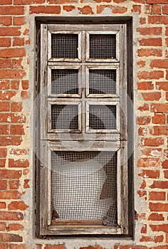 Window in an orange brick wall