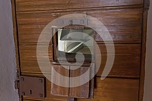 A window for passing food and observing prisoners in the door of a single cell in the Trubetskoy Bastion prison