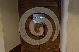 A window for passing food and observing prisoners in the door of a single cell in the Trubetskoy Bastion prison