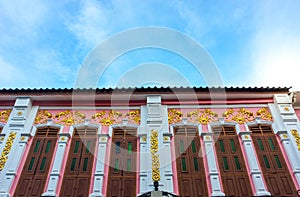 Window with pink background in Chino-Portuguese style, old town, Phuket, Thailand photo