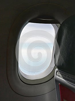 The window of the plane taken from the outside.