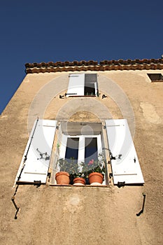Window with pots of flowes