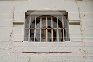 Window of prison cell with bars, close up