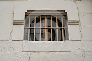 Window of prison cell with bars, close up
