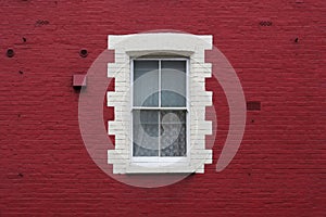 Window in red wall