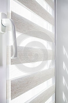 Window roller duo system day and night. Close up on roll curtains indoor.